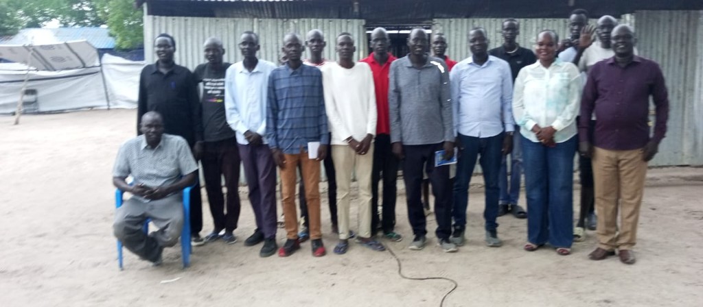 WORD staff and partners standing together outside a programme building.